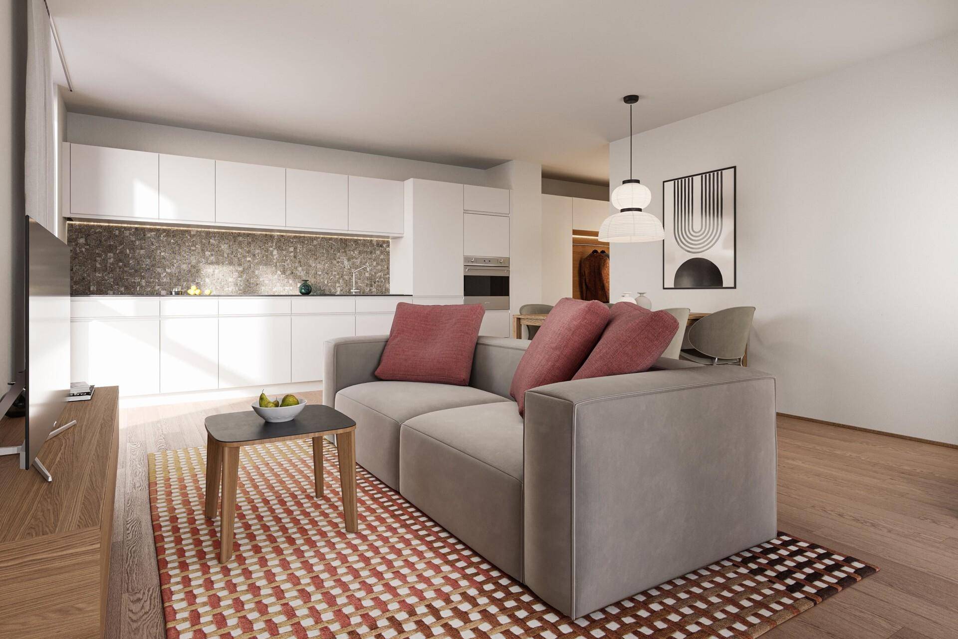 Modernes Wohnzimmer mit offener Küche, Holzboden und zeitgenössischer Dekoration.