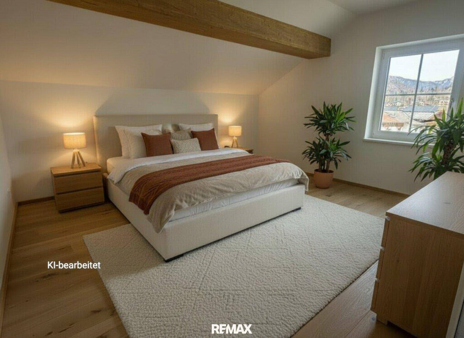 Gemütliches Schlafzimmer mit Holzbalken, schrägen Decken, Holzboden und Bergblick.