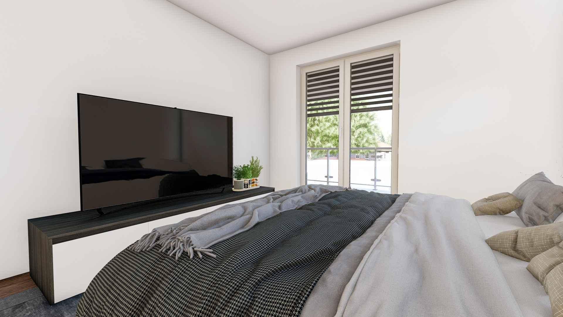 Schlafzimmer mit großem Bett, Fernseher und Zugang zu einem französischen Balkon.