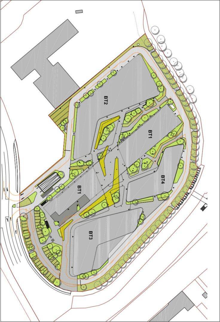 Übersichtsplan eines Gewerbegebiets mit mehreren Gebäudeblöcken, Parkplätzen und Grünflächen.