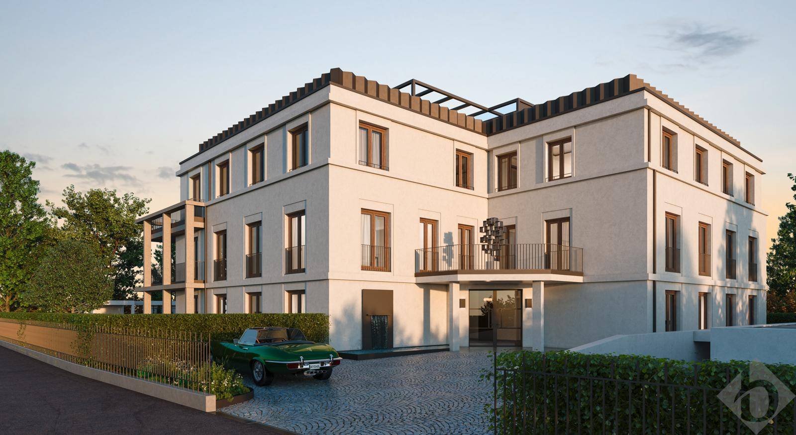 Moderne Architektur der Wohnanlage mit gepflasterter Auffahrt und klassischem Auto.