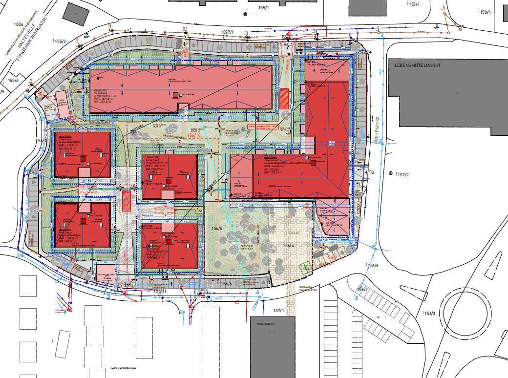 Übersichtsplan des Bauprojekts mit mehreren Gebäuden, Grünflächen und umliegenden Wegen.