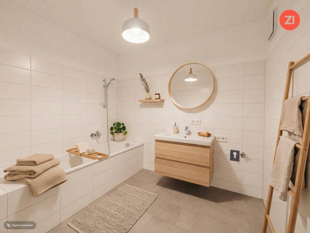 Modernes Badezimmer mit Badewanne, schwebendem Waschtisch und weißen Wandfliesen.