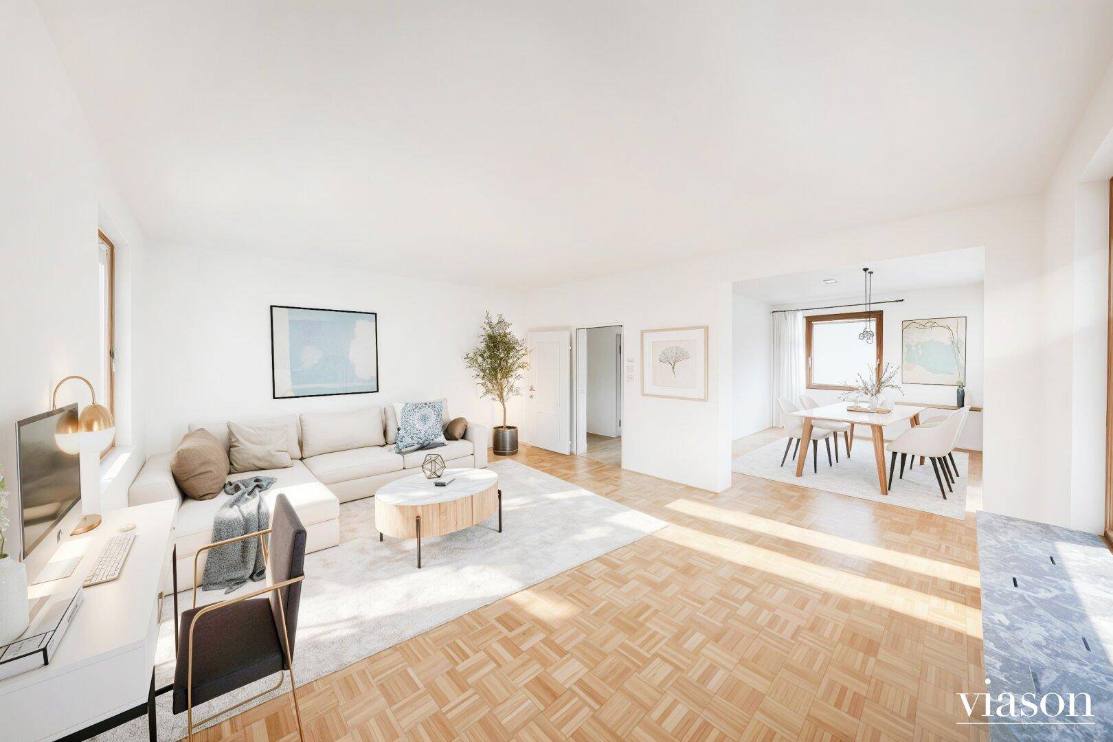 Helles, modern eingerichtetes Wohn- und Esszimmer mit Parkettboden und integriertem Arbeitsbereich.