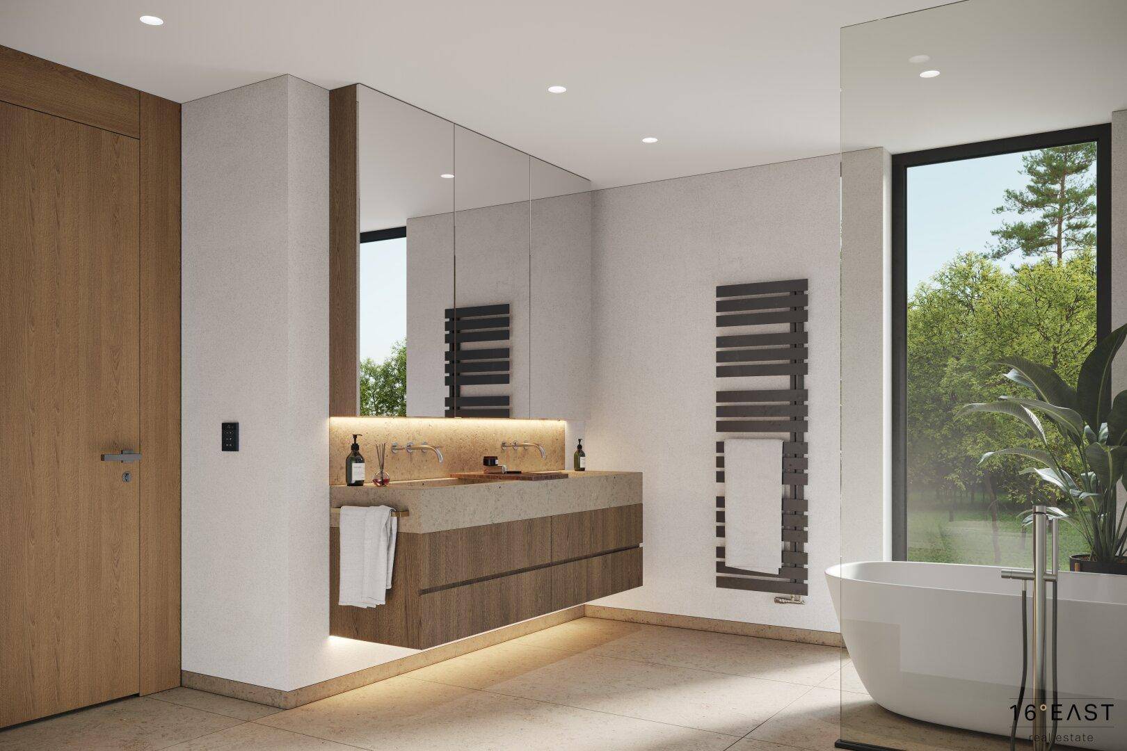 Modernes Badezimmer mit freistehender Badewanne, Doppelwaschbecken und großem Fenster.