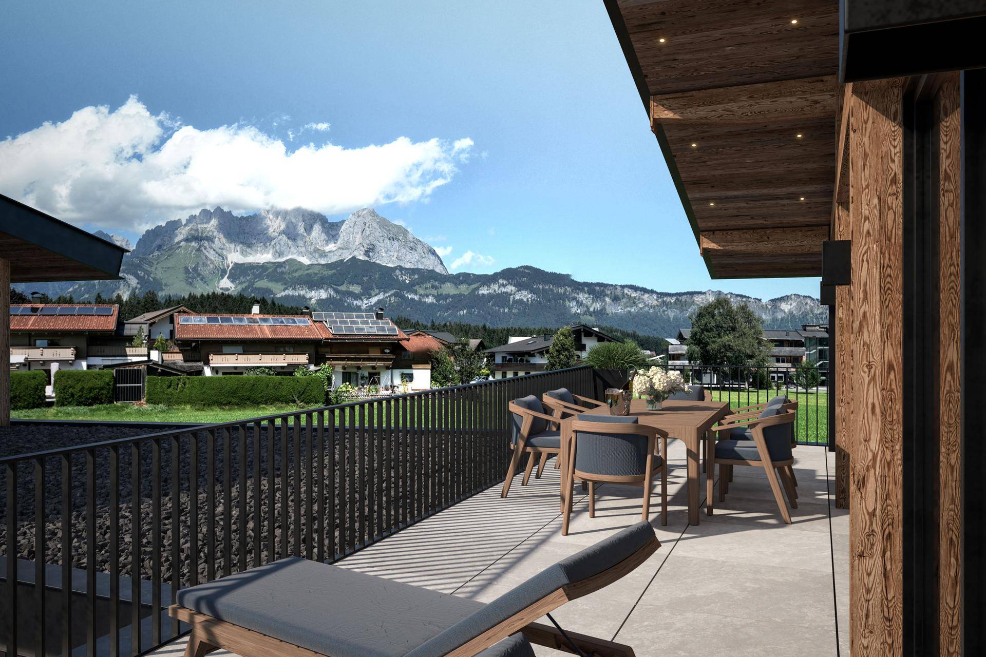 Geräumiger Balkon mit Sitzgelegenheiten und atemberaubendem Blick auf die umliegende Bergwelt.