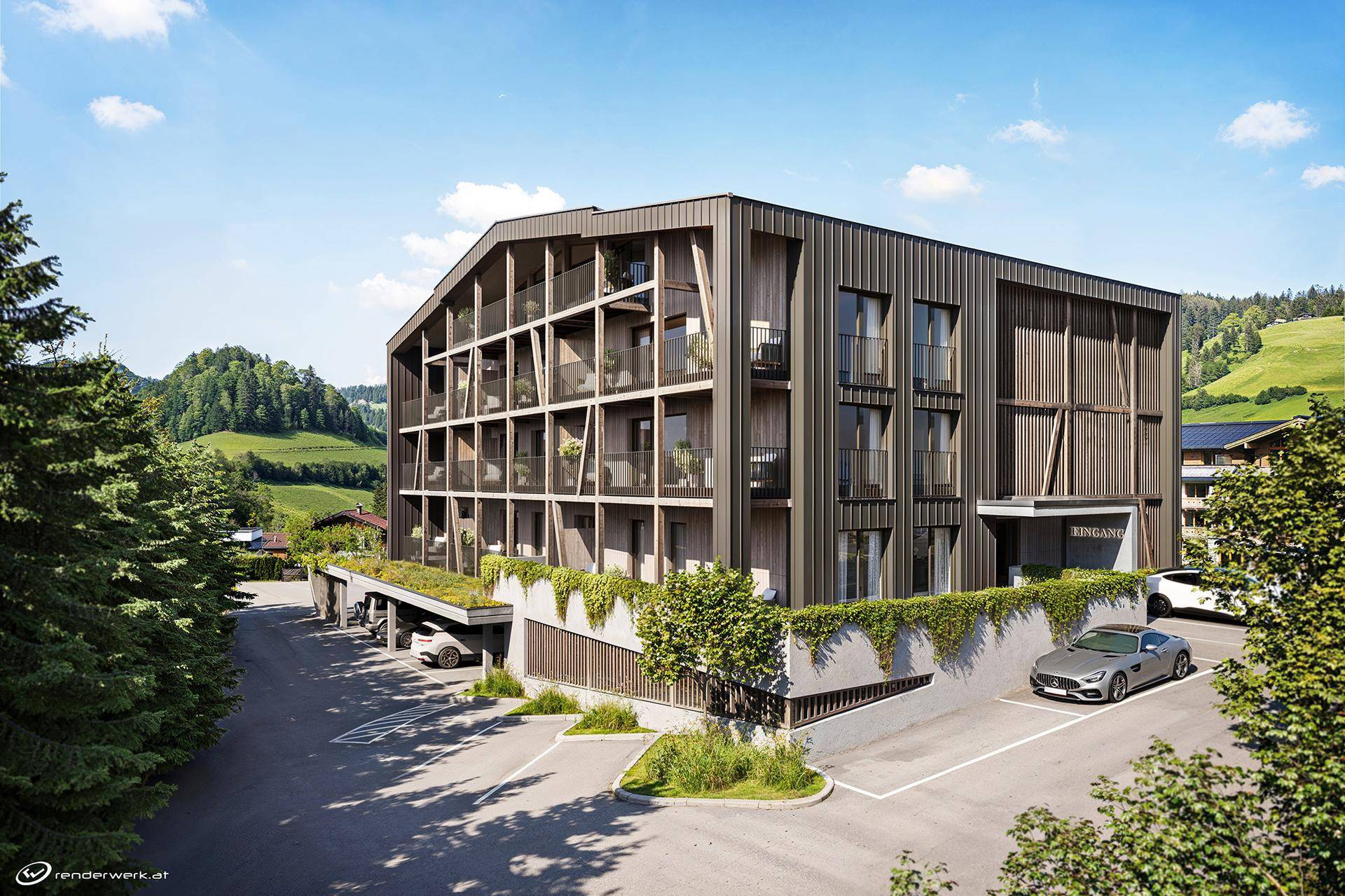 Zeitgenössisches Gebäude mit Holzfassade und Tiefgaragenzufahrt, eingebettet in eine grüne Hügellandschaft.