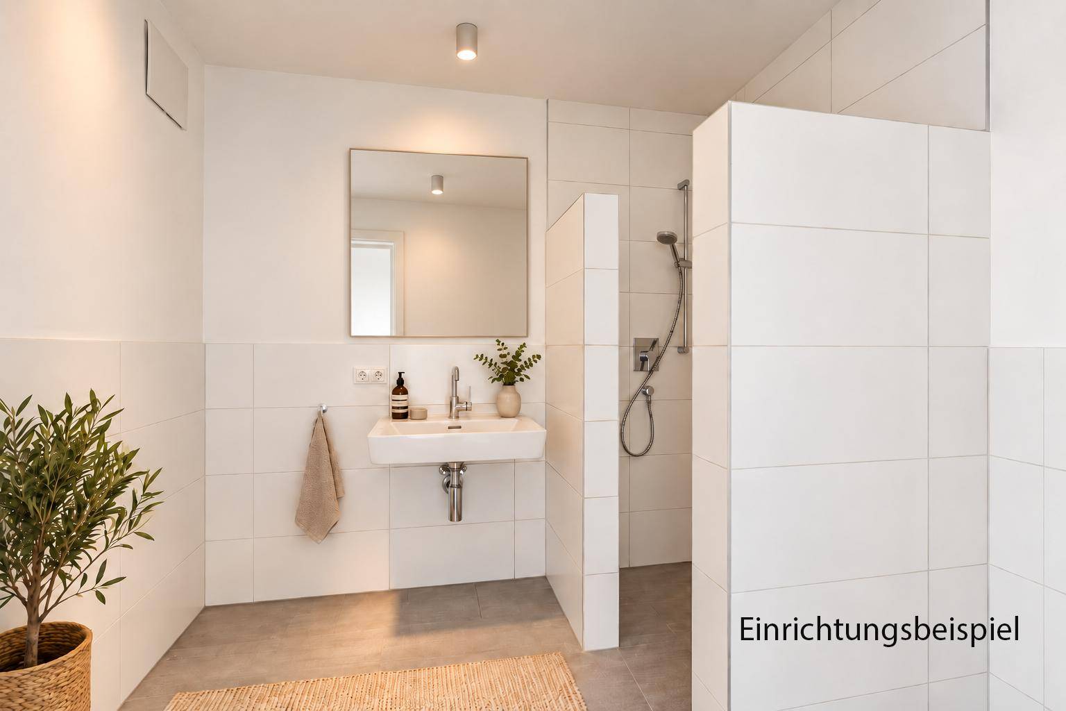 Modernes Badezimmer mit Waschbecken, großer begehbarer Dusche und hellen Fliesen.