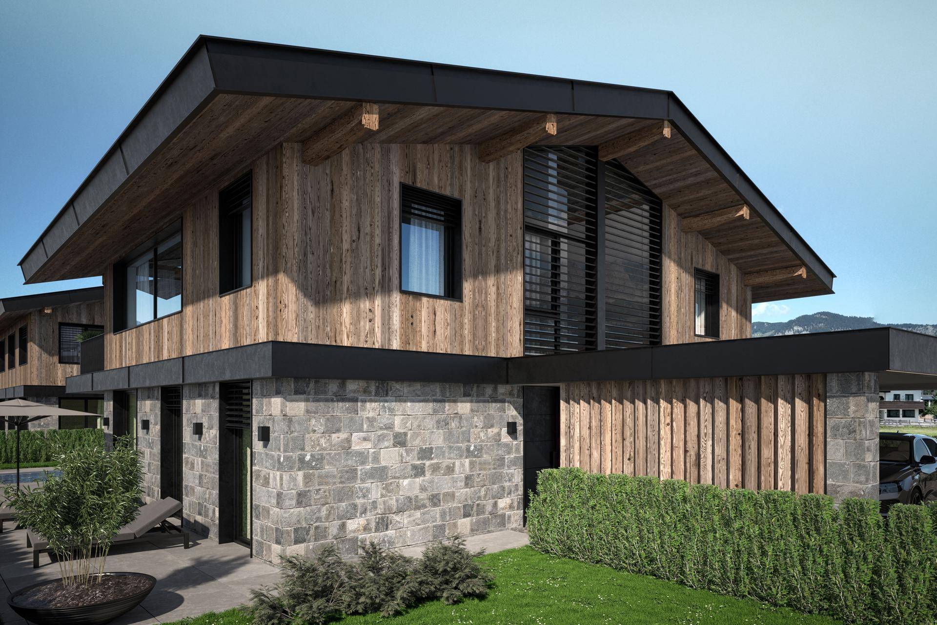 Elegante Fassade einer modernen Villa mit Holzverkleidung und Steinelementen in alpiner Umgebung.