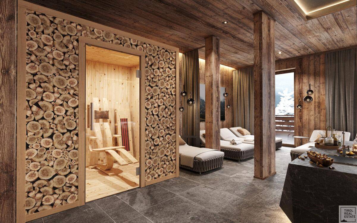 Stilvoller Ruheraum mit Zugang zur Sauna, Holzwandverkleidung und gemütlichen Liegemöglichkeiten.