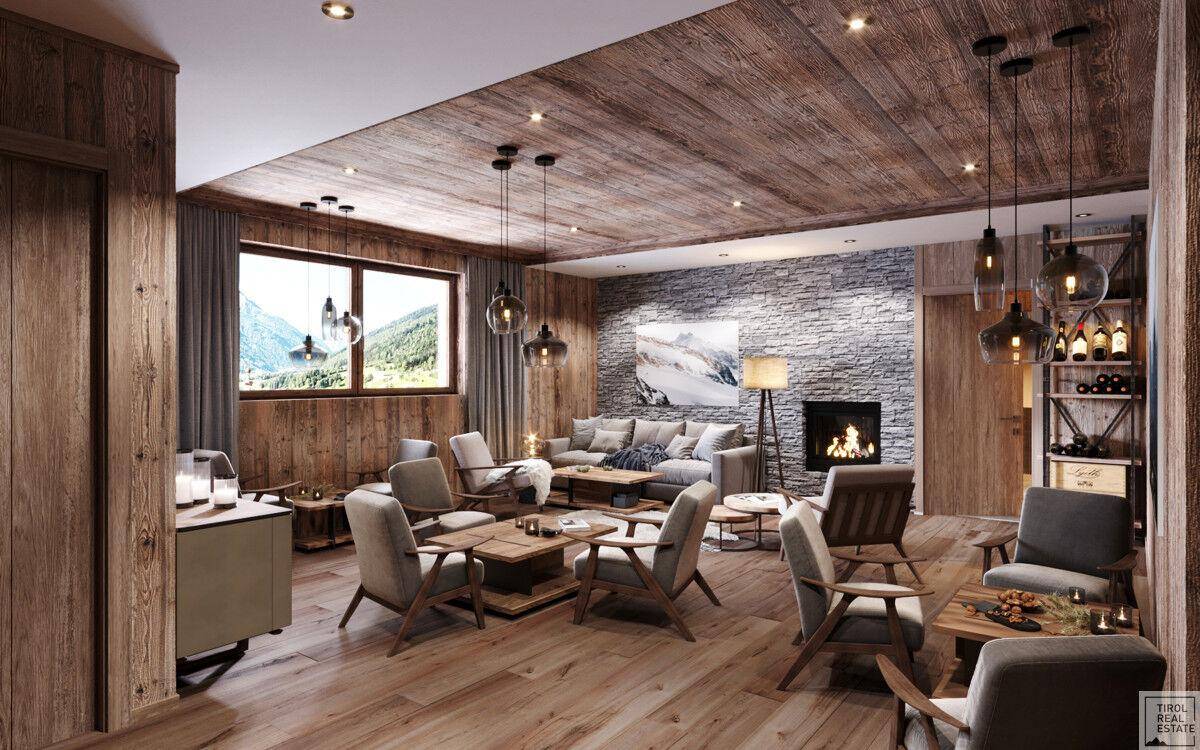 Gemütliches Wohnzimmer im alpinen Stil mit Holzboden, Kamin und bequemen Sitzgelegenheiten.