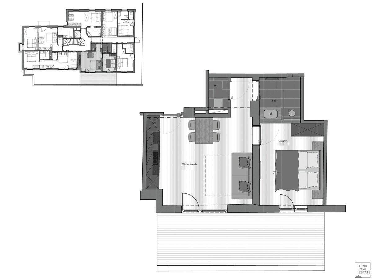 Grundriss einer Wohnung mit offenem Wohnbereich, Schlafzimmer und großem Balkon.