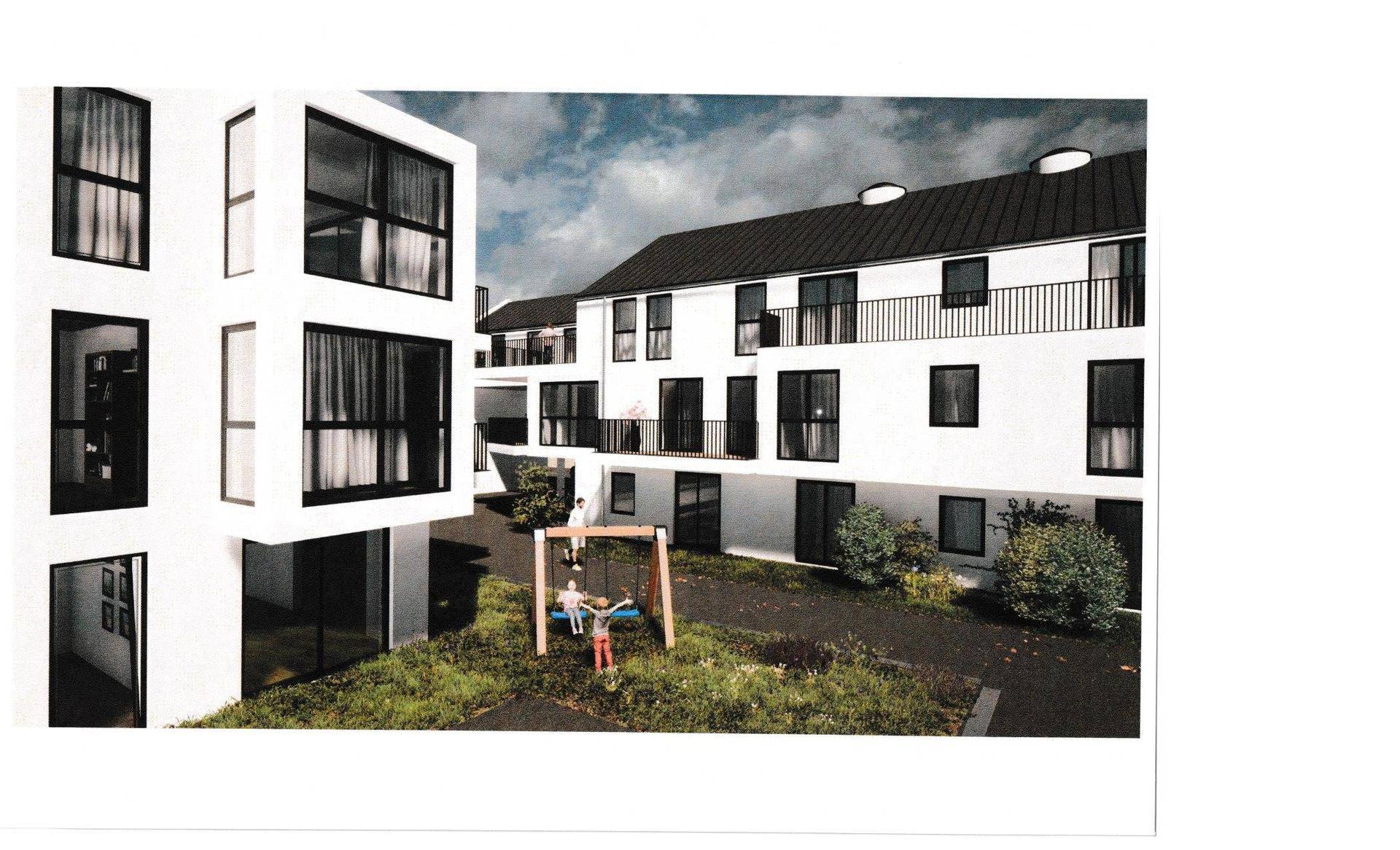 Moderne Wohnanlage mit begrüntem Innenhof und Kinderspielplatz.