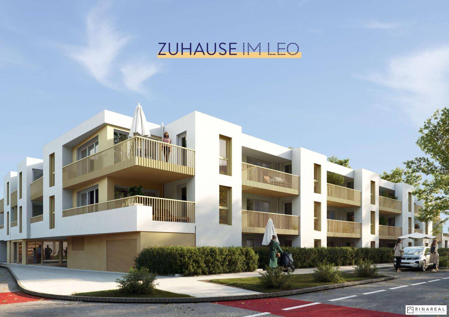 Moderne Wohnanlage mit Balkonen und gepflegter Außenanlage an einer Straße.