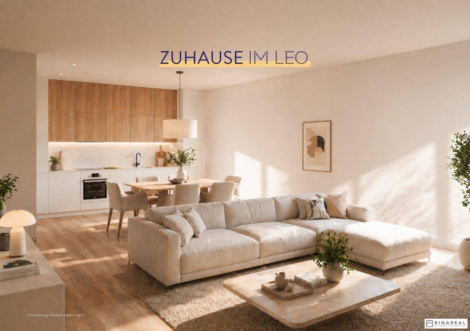 Offener Wohn-Essbereich mit integrierter Küche, modernem Sofa und viel Tageslicht.