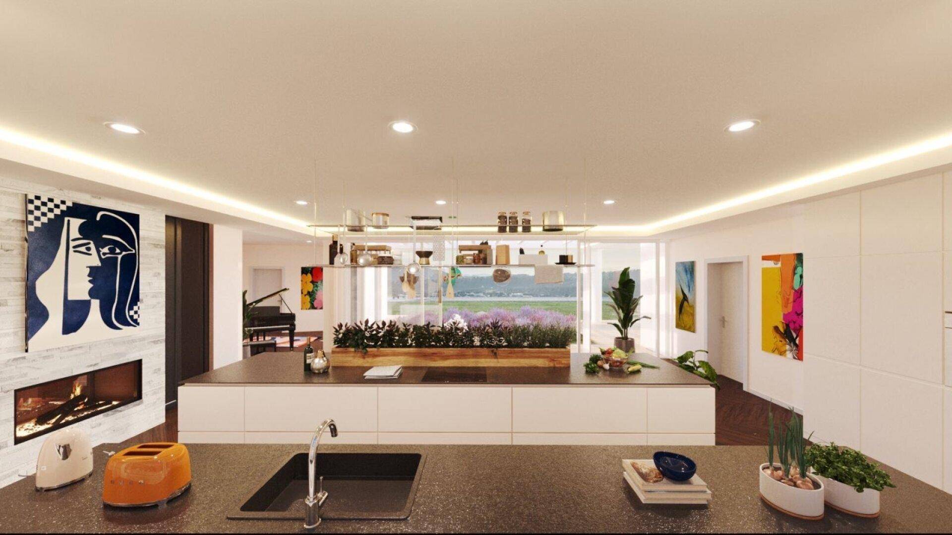 Moderne Küche mit Kochinsel, integriertem Kamin und Blick ins Grüne.
