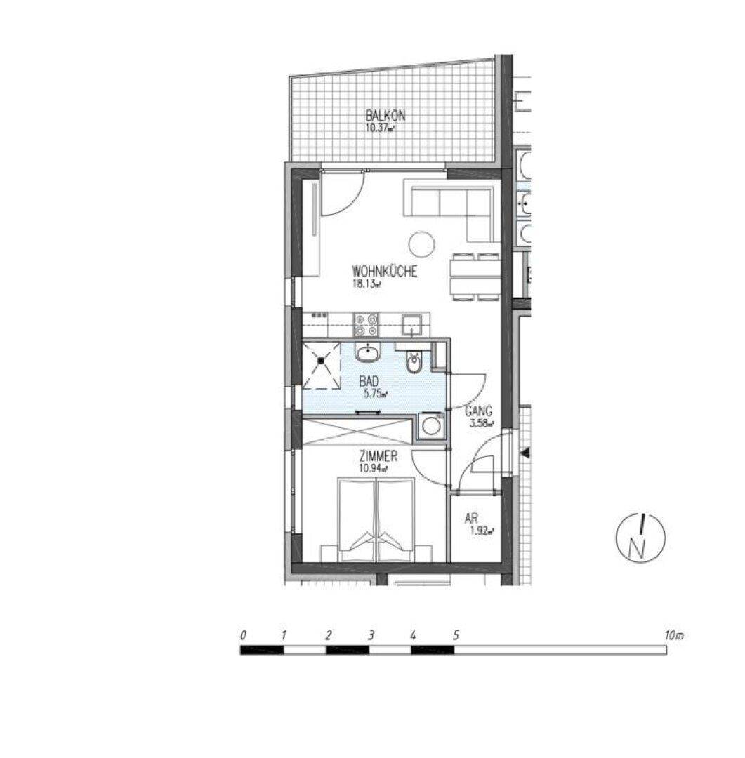 Grundriss einer Wohneinheit mit Balkon, offener Wohnküche und einem Schlafzimmer.