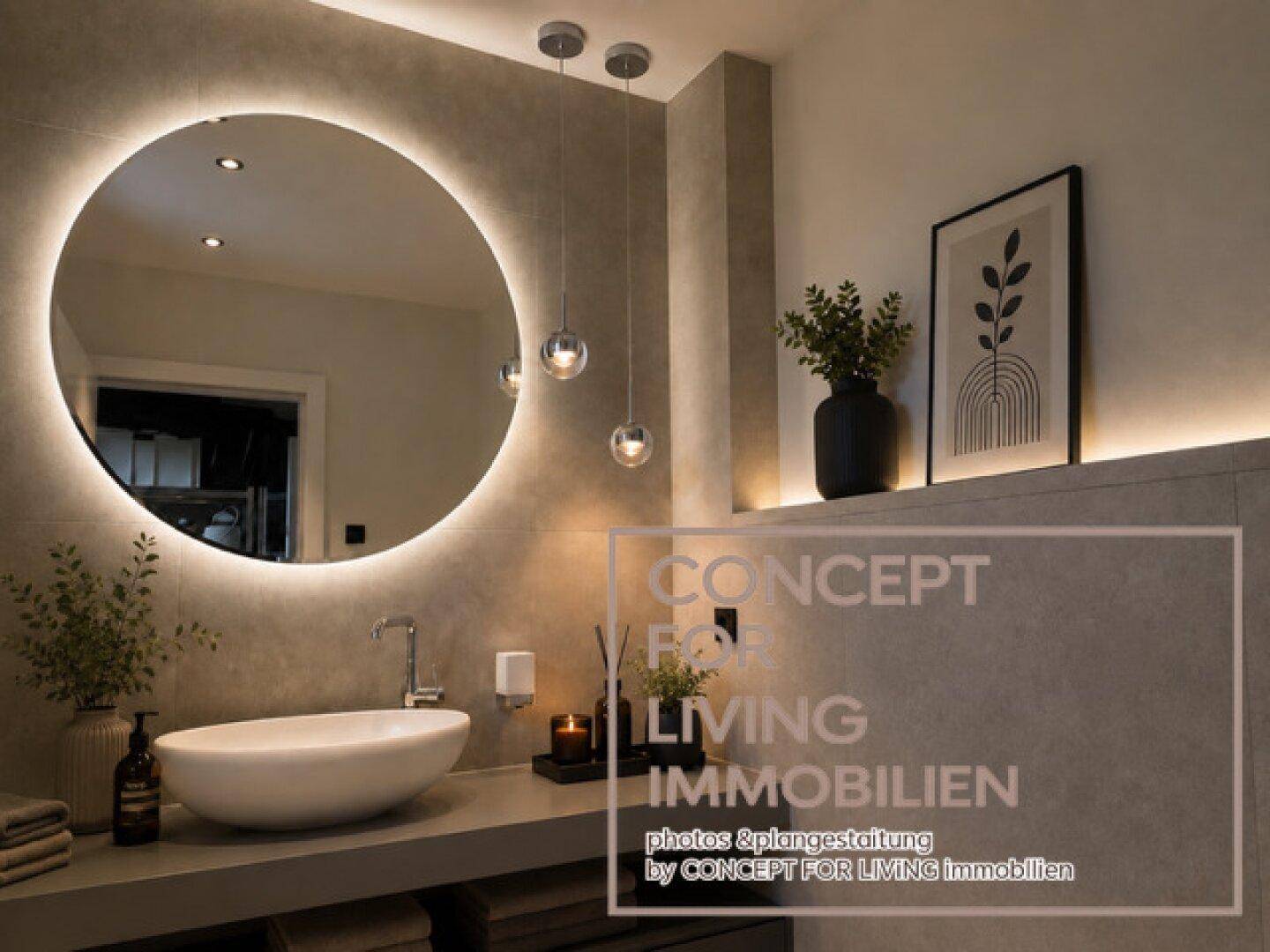 Stilvolles Badezimmer mit rundem, beleuchtetem Spiegel und modernem Aufsatzwaschbecken.