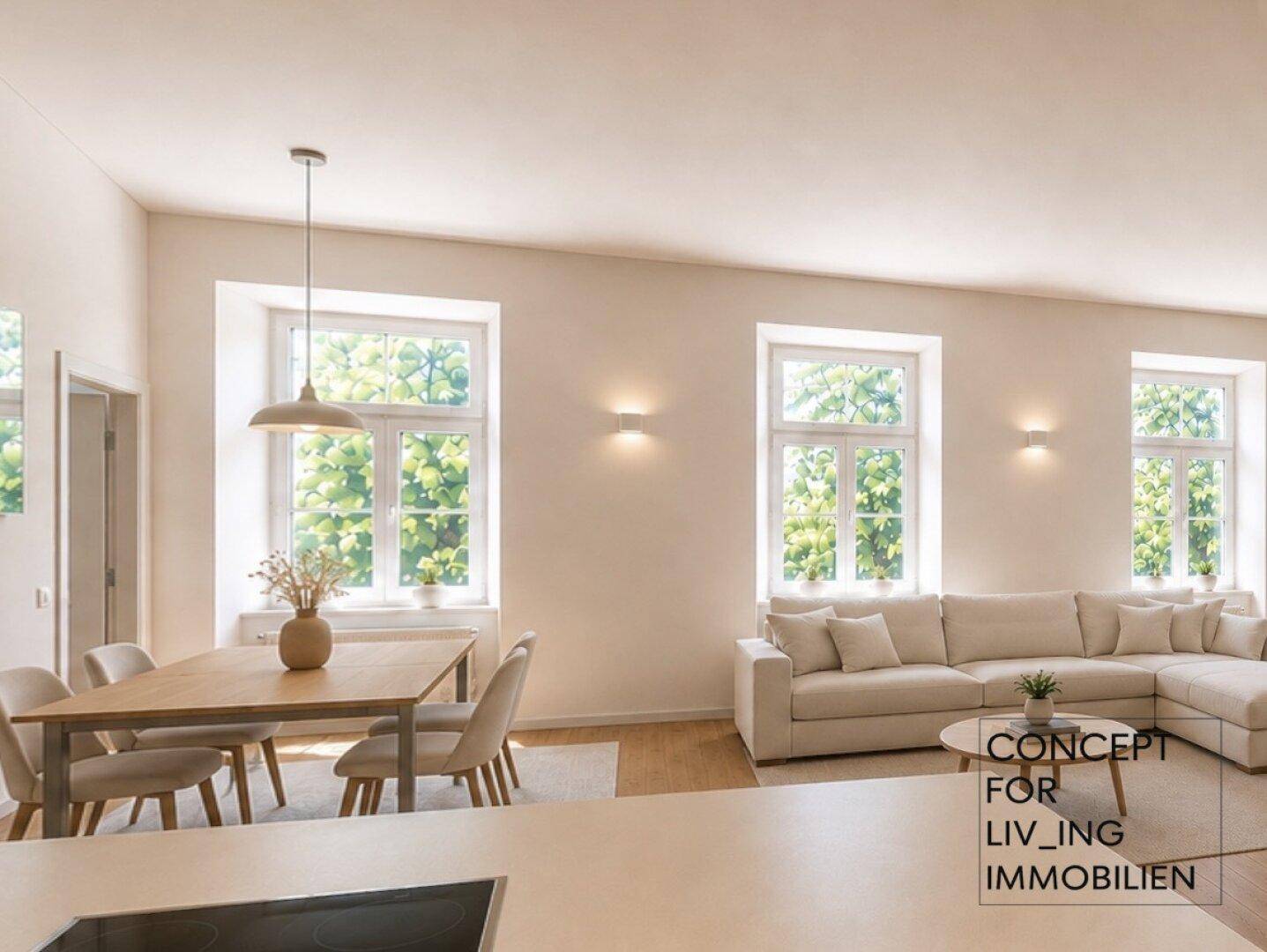 Heller Wohn- und Essbereich mit Esstisch, Sofa und Blick ins Grüne.