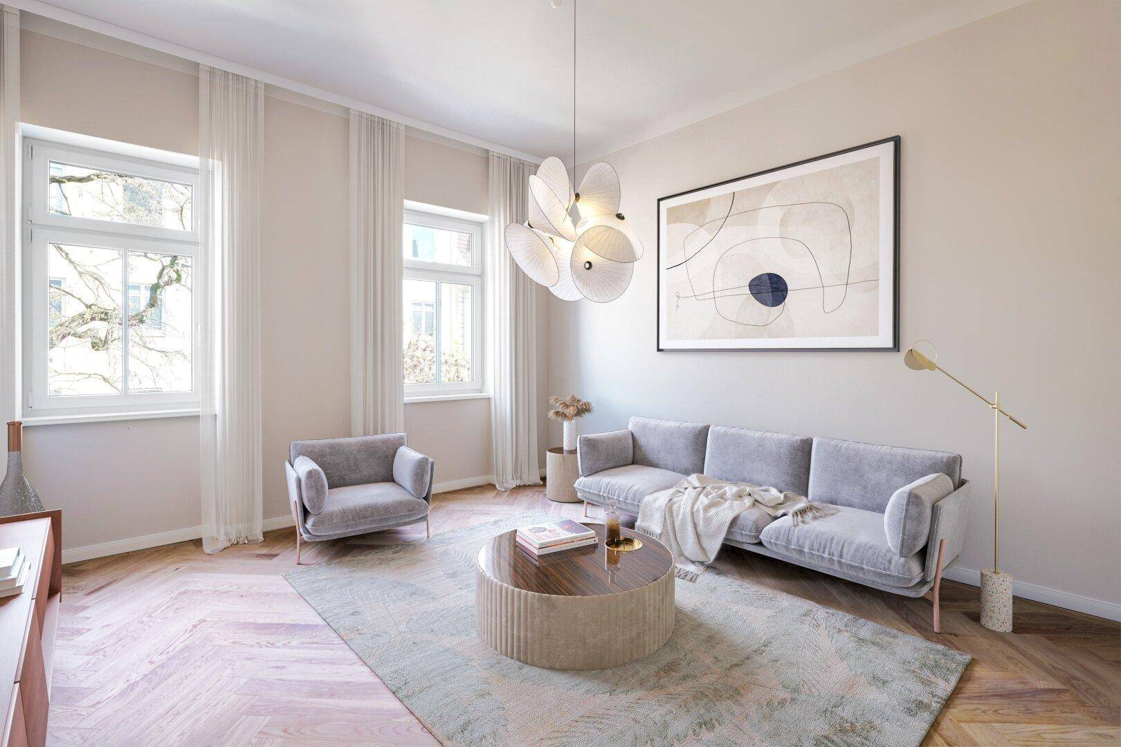 Modernes Wohnzimmer mit grauem Sofa, Sessel, rundem Couchtisch und hellem Fischgrätparkett.