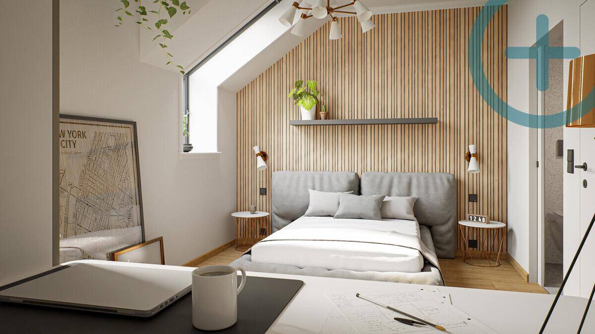 Gemütliches Schlafzimmer mit Dachschräge, Holzwandverkleidung und natürlichem Lichteinfall.