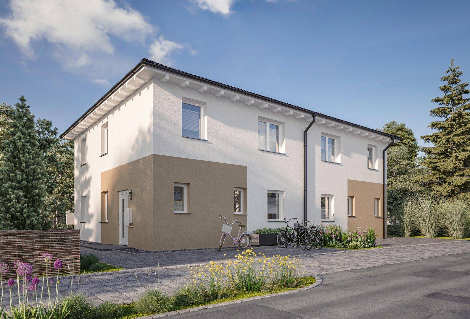 Ansicht der modernen Doppelhaushälfte mit weißer und beiger Fassade sowie einem gepflasterten Eingangsbereich.