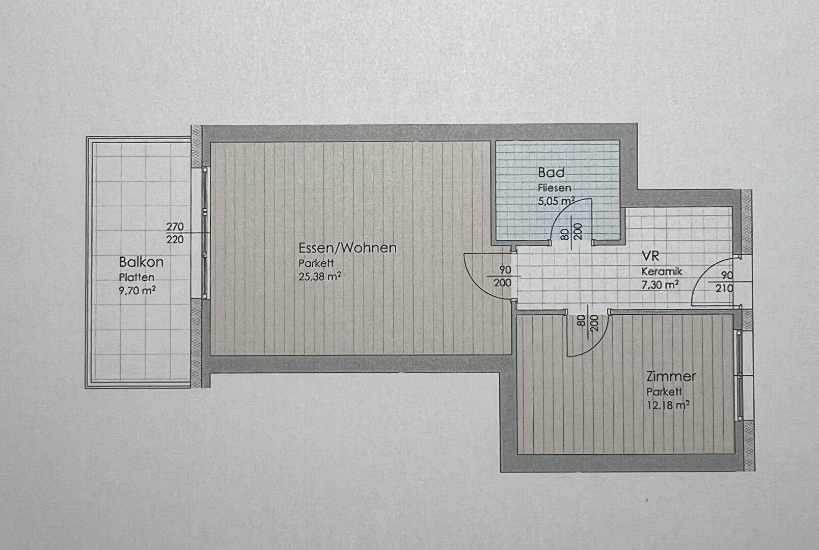 Grundriss einer Wohnung mit offenem Wohn-Essbereich, einem Schlafzimmer, Bad und Balkon.