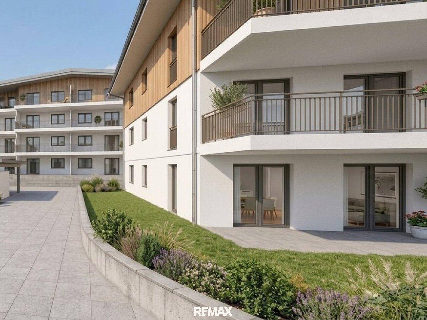 Moderne Wohngebäude mit Balkonen, Terrassen und liebevoll gestalteten Grünflächen.