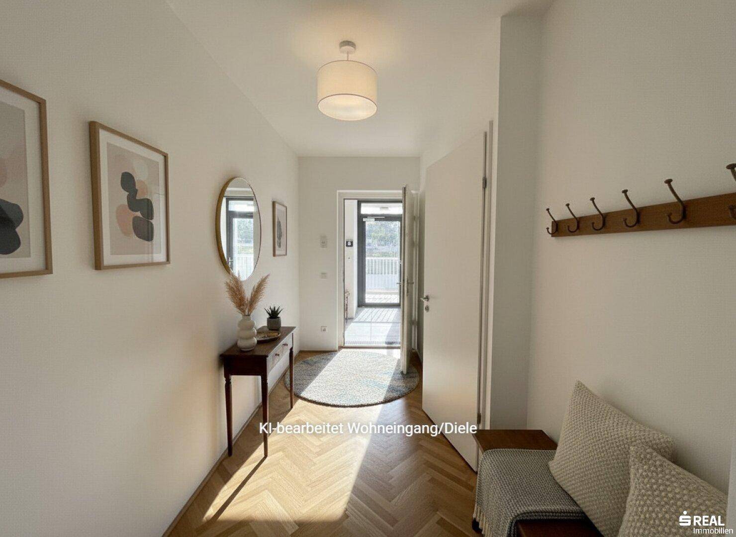 Heller Eingangsbereich mit Parkettboden, Garderobe und Blick in den Flur.