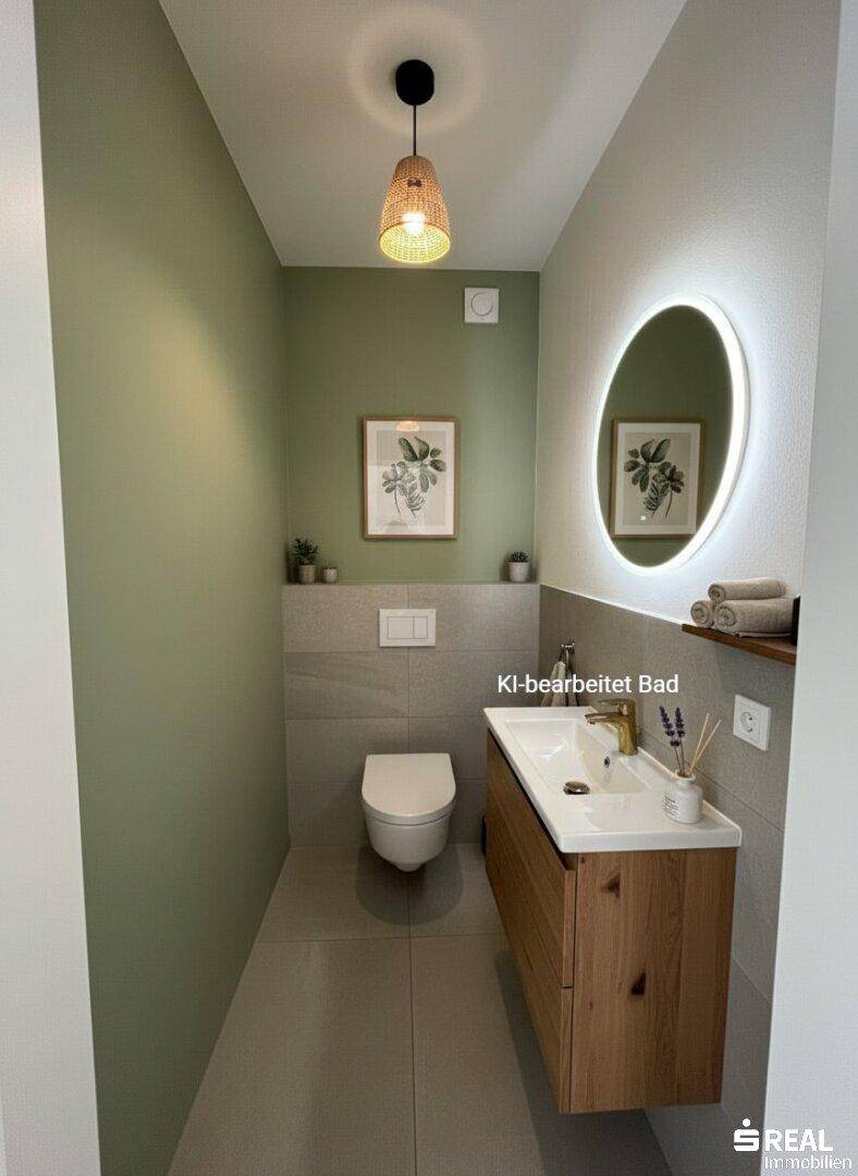Stilvolles Gäste-WC mit modernem Waschtisch, beleuchtetem Spiegel und grüner Akzentwand.