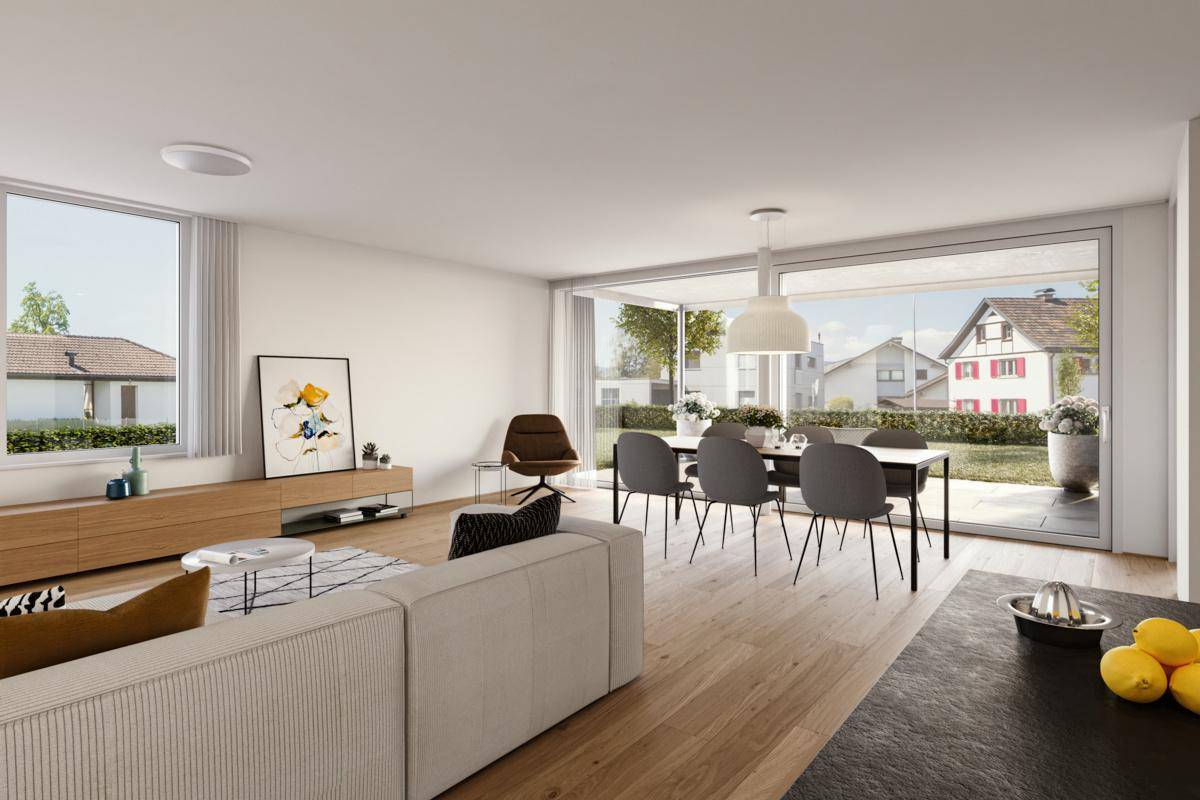 Heller Wohn-Essbereich mit Holzboden, modernen Möbeln und großen Fenstern zum Garten.