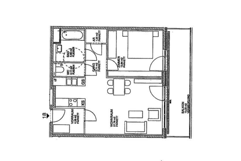 Grundriss einer Wohnung mit Wohnbereich, Schlafzimmer und Balkon.