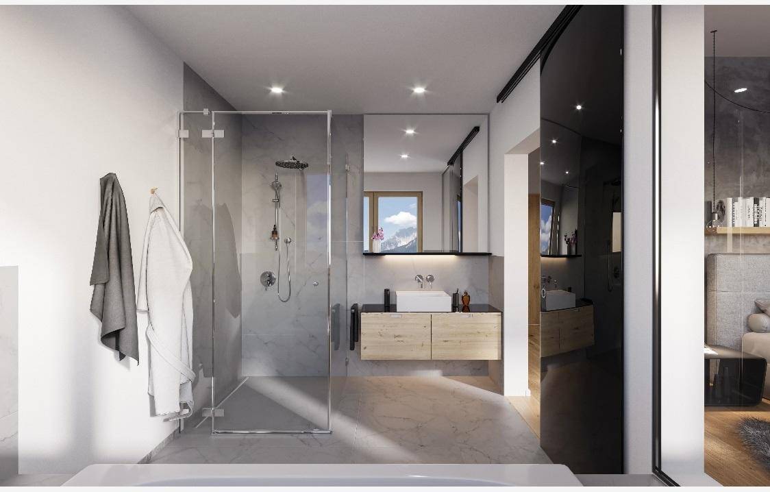 Modernes Badezimmer mit begehbarer Dusche, elegantem Waschtisch und hochwertigen Fliesen.