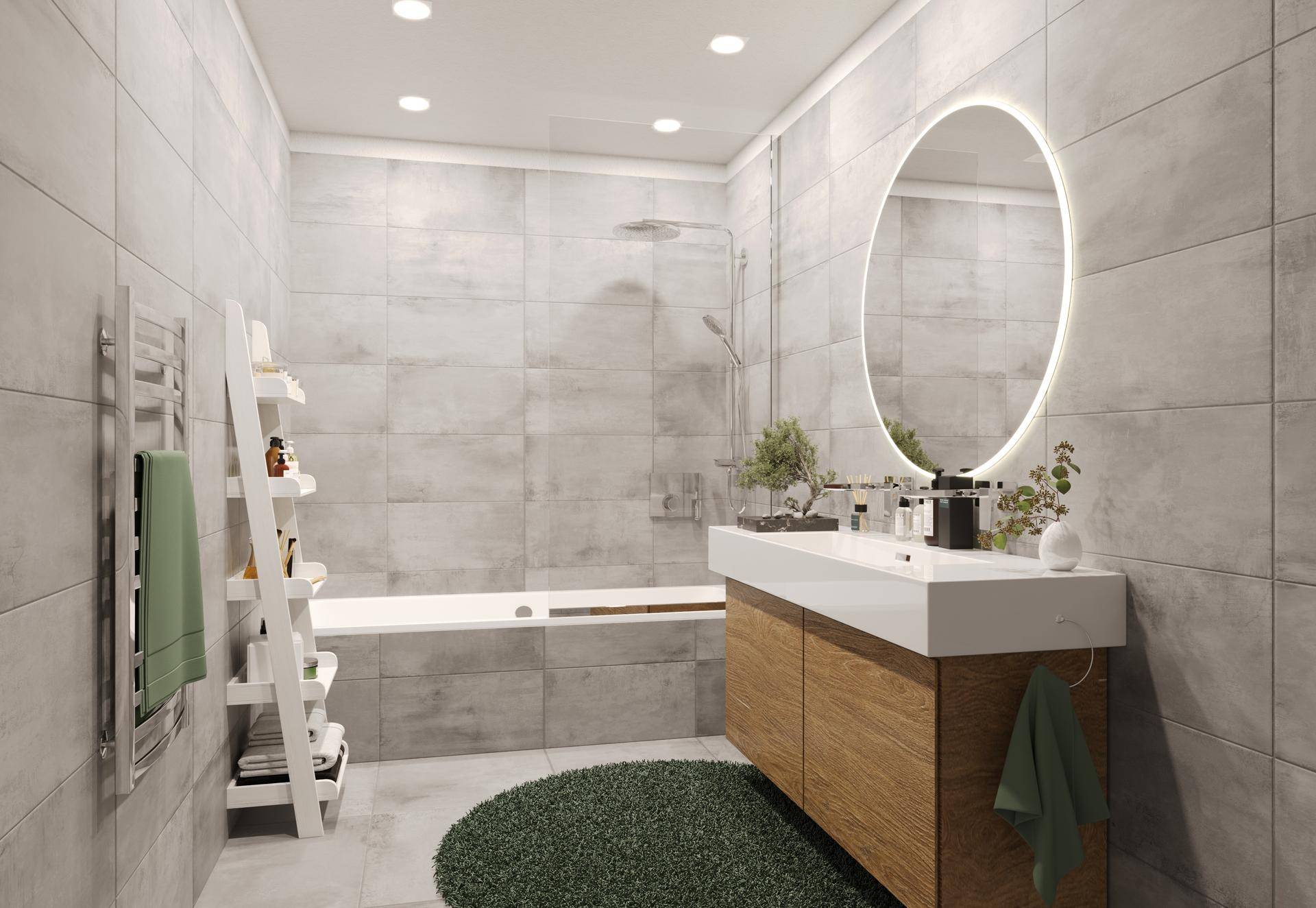Modernes Badezimmer mit grauen Fliesen, Badewanne und beleuchtetem Spiegel.