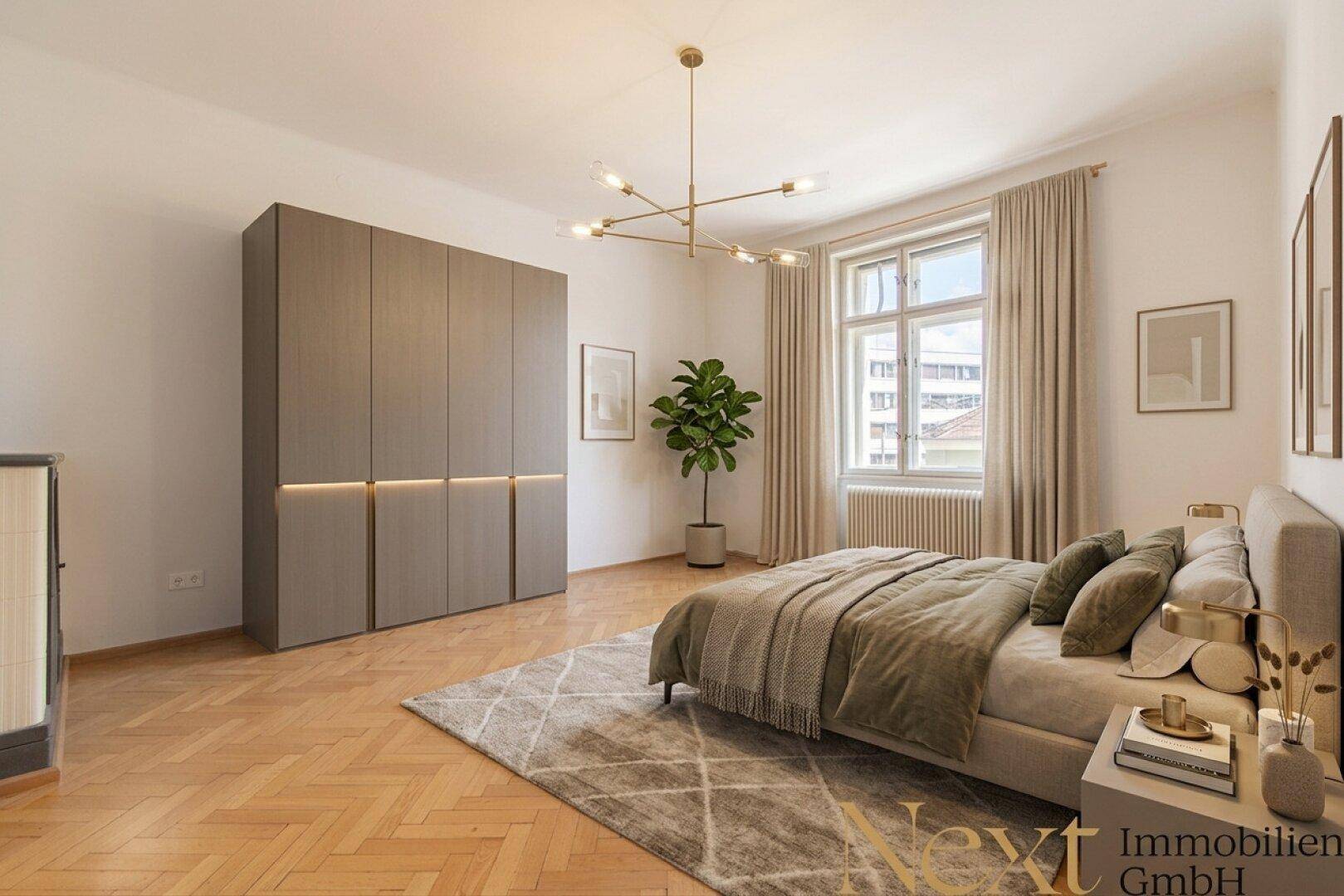 Modern eingerichtetes Schlafzimmer mit großem Kleiderschrank und Fischgrätparkett.