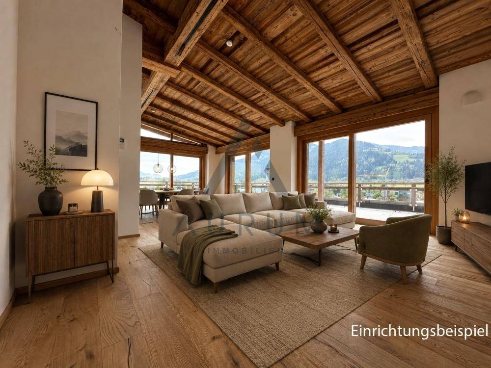 Offener Wohn- und Essbereich mit Holzbalkendecke, großen Fenstern und weitem Bergblick.