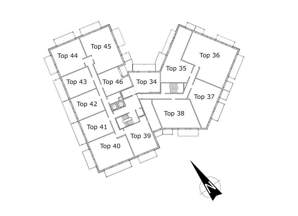 Grundriss einer oberen Etage mit mehreren Wohneinheiten und Balkonzugängen.