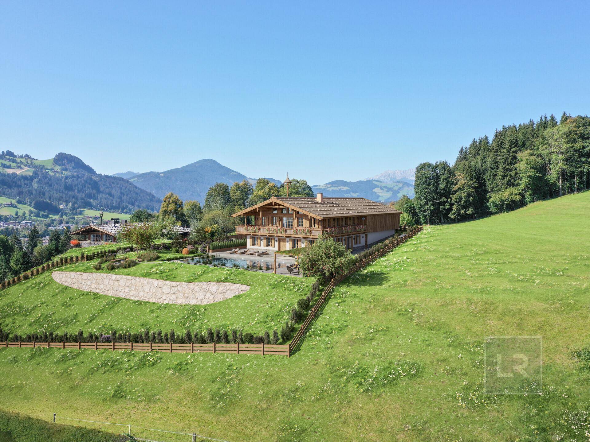 Weitläufige Ansicht des Anwesens mit traditionellem Chalet-Stil inmitten einer idyllischen Berglandschaft.