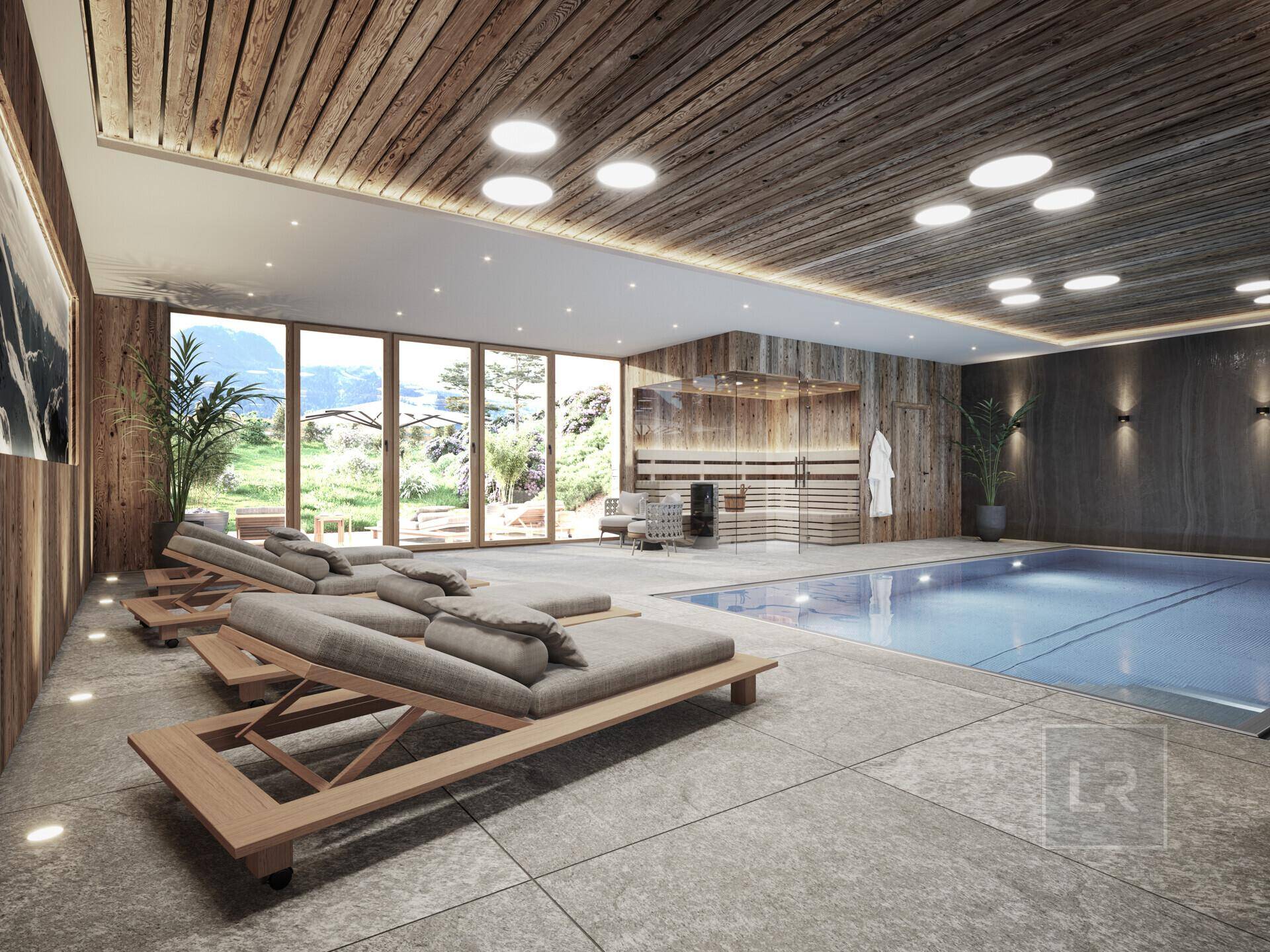 Exklusiver Wellnessbereich mit Innenpool, Sauna und großen Fenstern mit Bergblick.