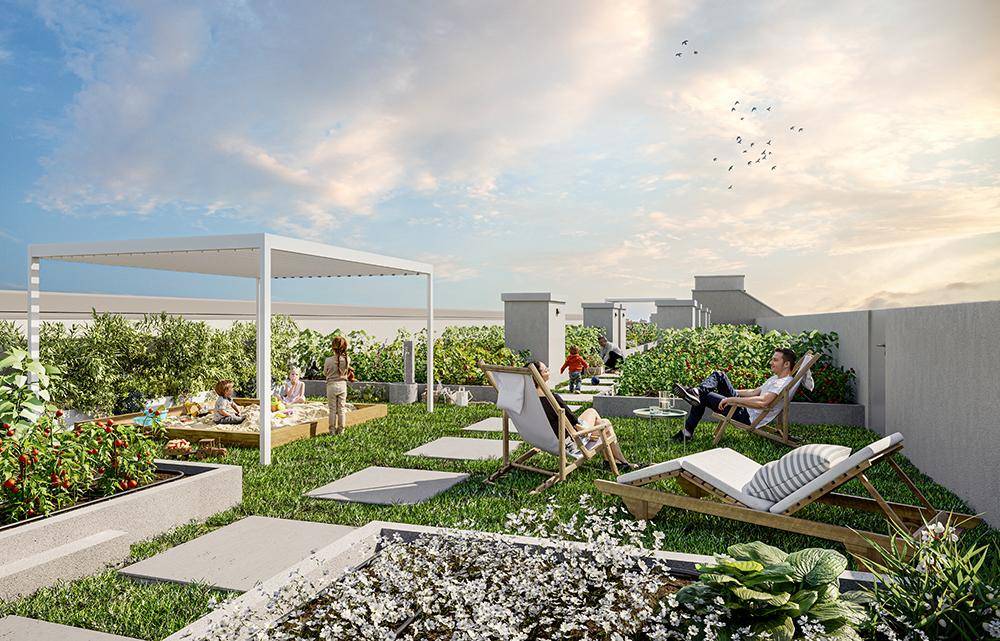 Begrünte Dachterrasse mit Sitzgelegenheiten, Sandkasten und Gemeinschaftsgartenbereichen für Bewohner.