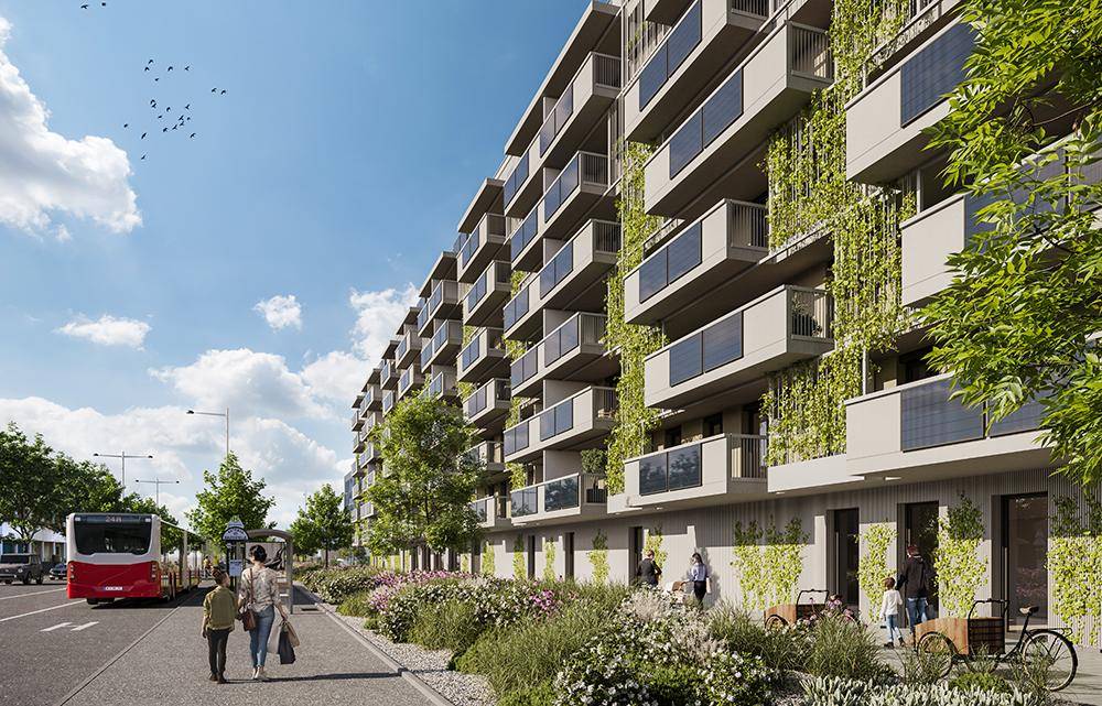 Moderne Wohngebäude mit vertikaler Begrünung, Balkonen und Photovoltaikanlagen an der Fassade.