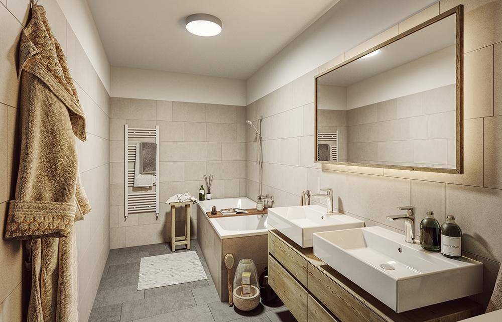 Modernes Badezimmer mit Doppelwaschbecken, Badewanne und beheiztem Handtuchhalter in hellen Farbtönen.