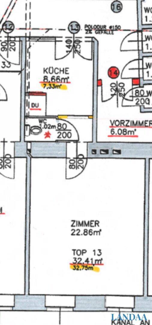 Grundriss einer Wohnung mit separater Küche, WC und einem geräumigen Zimmer.