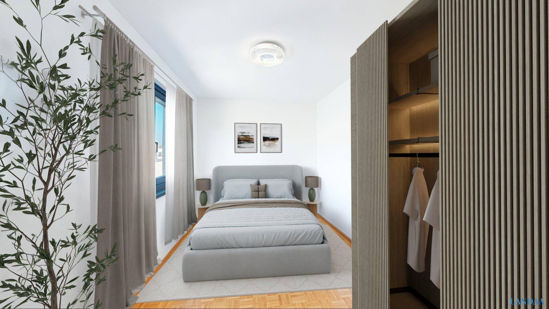 Gemütliches Schlafzimmer mit Holzboden, Einbauschrank und Blick ins Grüne.