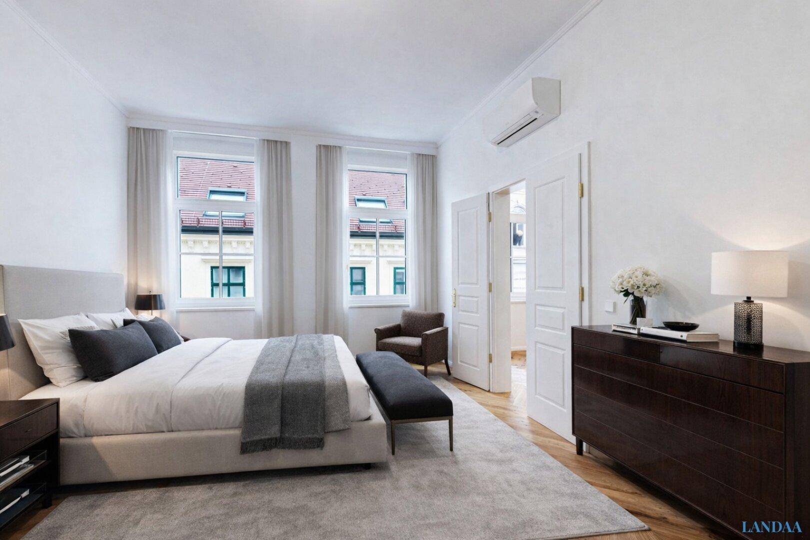 Modernes Schlafzimmer mit Doppelbett, Teppich und Klimaanlage.