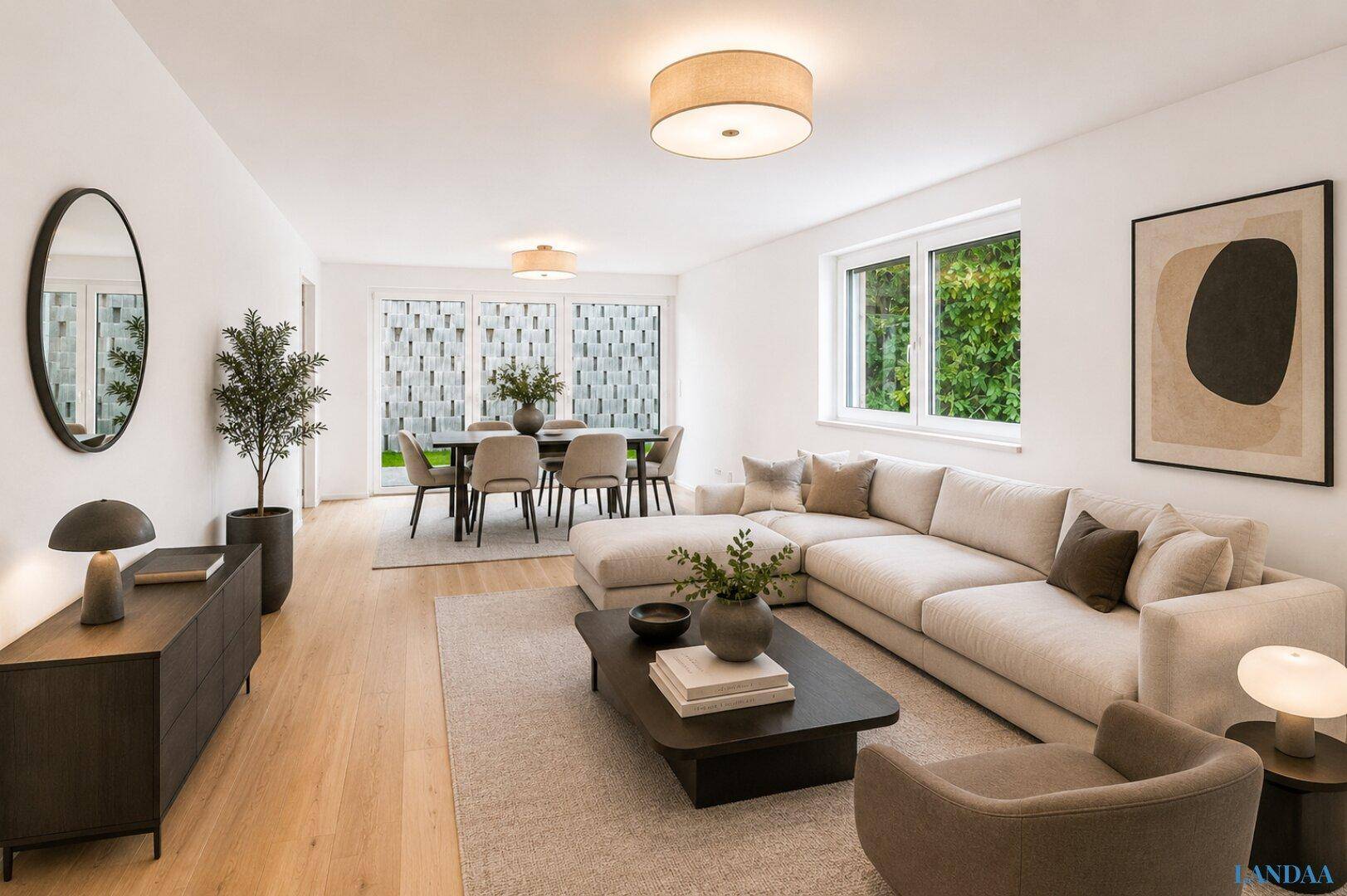 Offener Wohn- und Essbereich mit modernem Sofa, Esstisch und Zugang zur Terrasse.