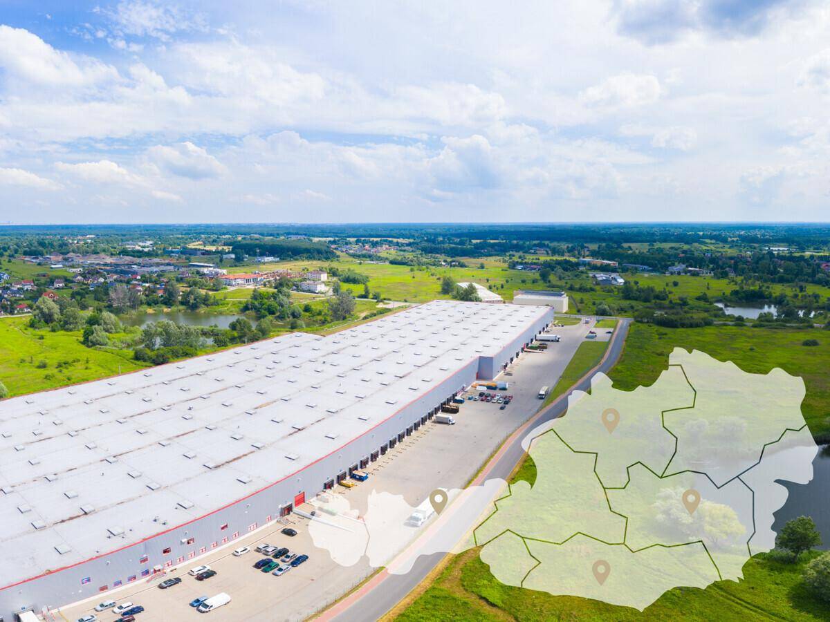 Luftaufnahme eines weitläufigen Gewerbekomplexes umgeben von grüner Landschaft mit markierten Standorten.
