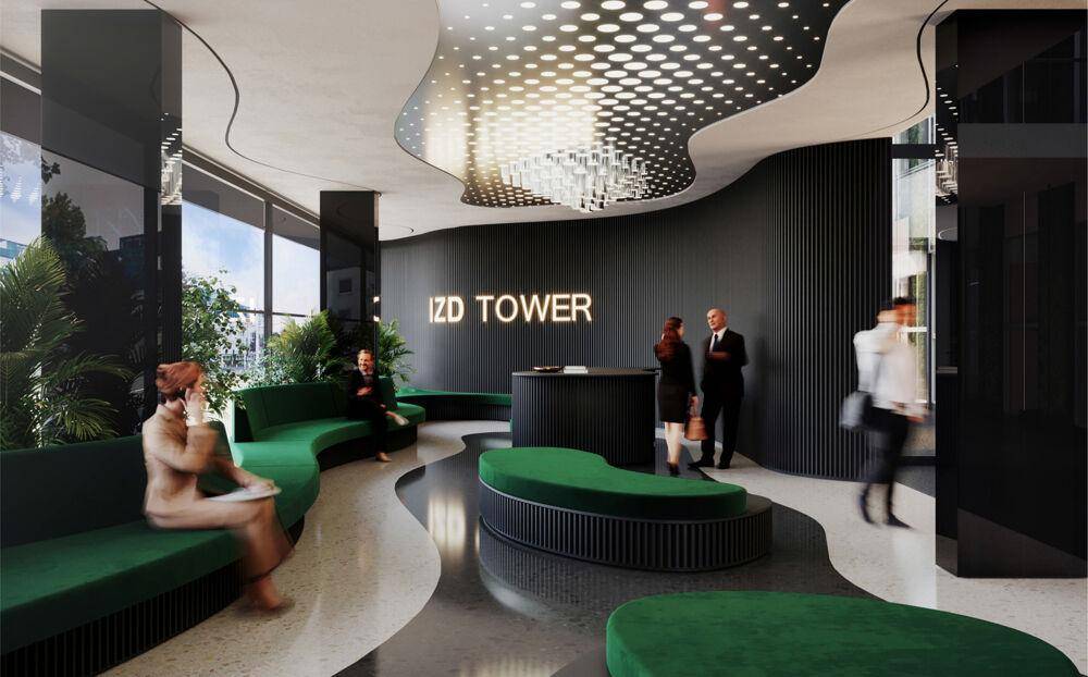Elegante, moderne Lobby mit geschwungenen grünen Sitzgelegenheiten und einer auffälligen Deckenbeleuchtung.