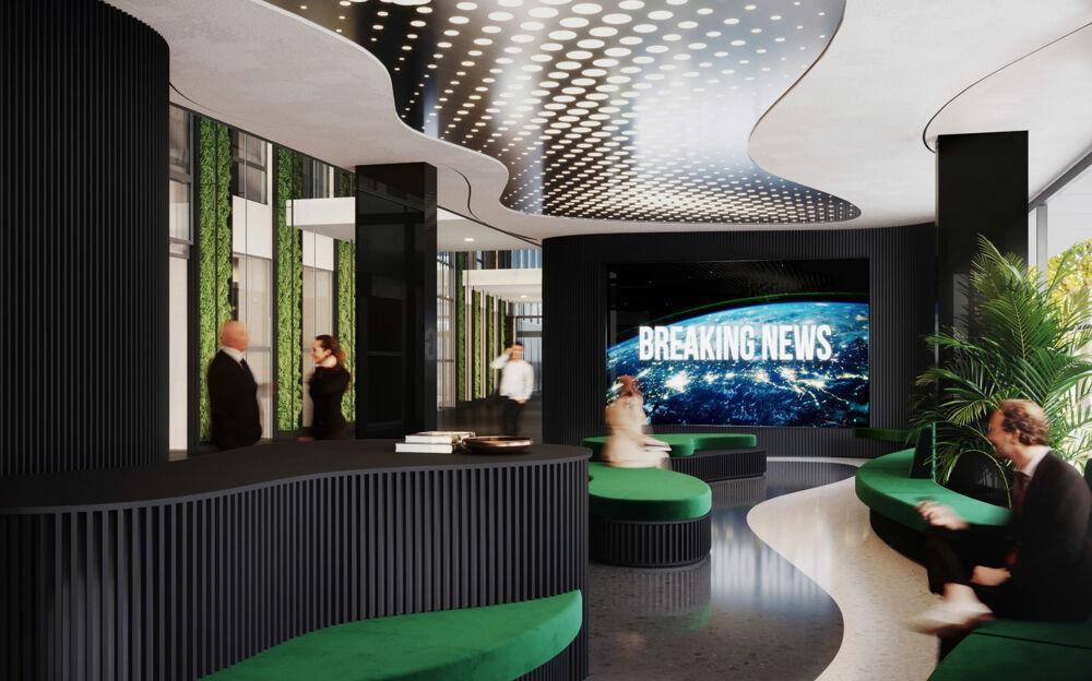 Futuristische Lobby mit dynamischer Deckenbeleuchtung, großem Bildschirm und bequemen grünen Sitzmöbeln.