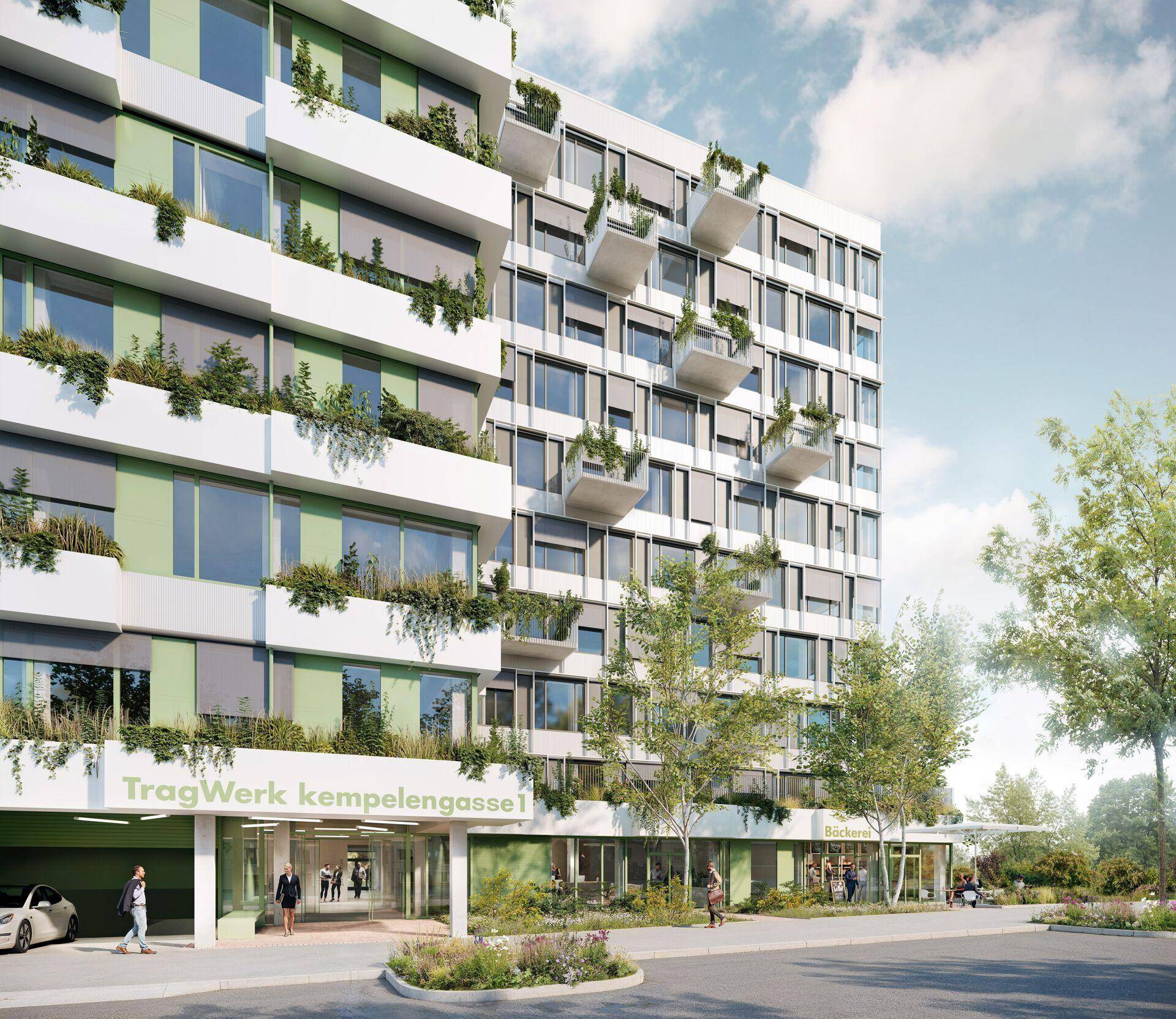 Eine moderne Gebäudefassade mit Tiefgarageneinfahrt, Einzelhandelsflächen im Erdgeschoss und begrünten Balkonen.